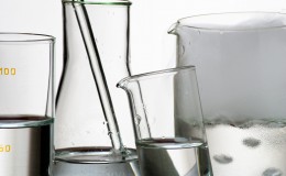 Laboratory glassware during experiment and vapors over liquid